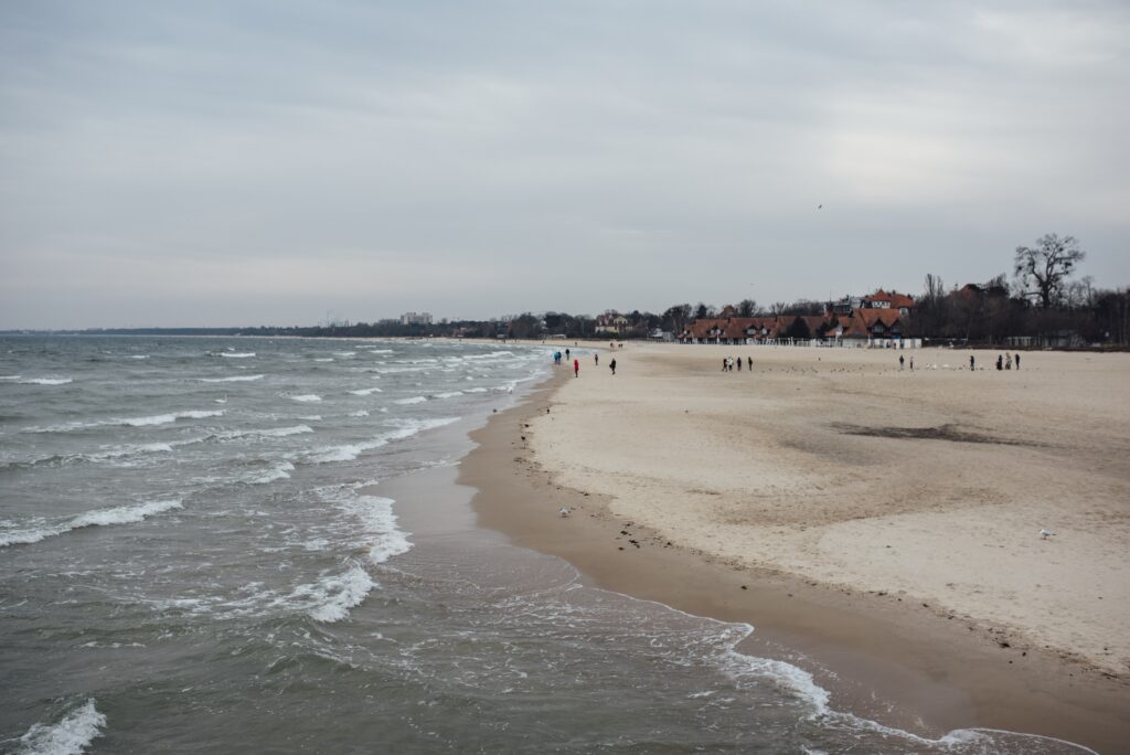 top beaches in maharstra in hindi 2 beach surrounded by sea buildings cloudy sky daytime